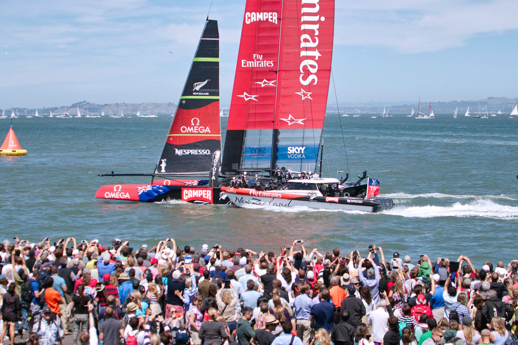 ETNZ doing a flyby past AC Village spectators.  - America's Cup © Chuck Lantz http://www.ChuckLantz.com